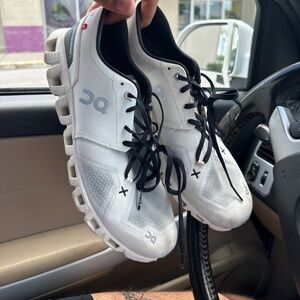 On Running White and Black Athletic Shoes